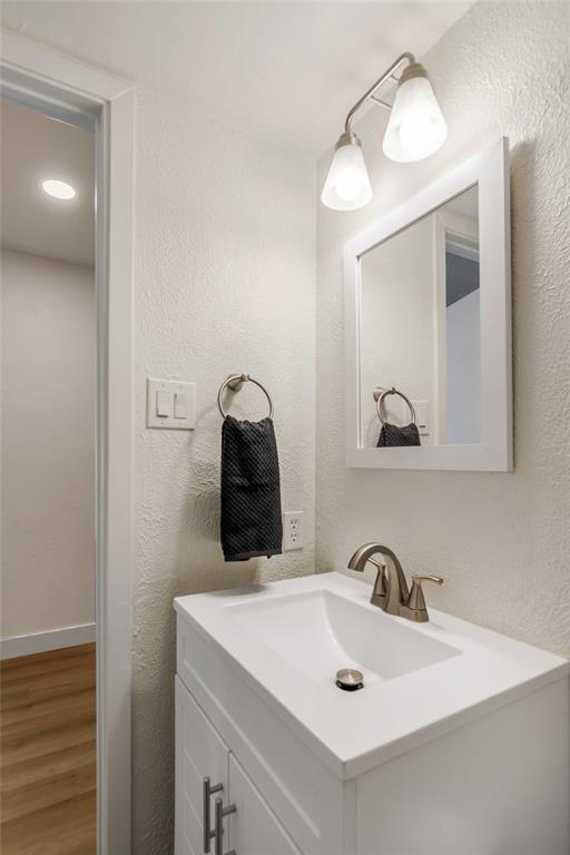 3708 Spring Meadow Lane Flower Mound, TX 75028 - Photo 10 of 39 a bathroom with a sink and a mirror