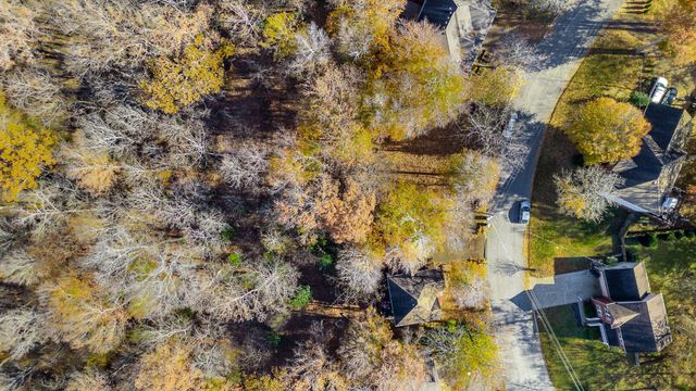 a aerial view of residential houses with yard