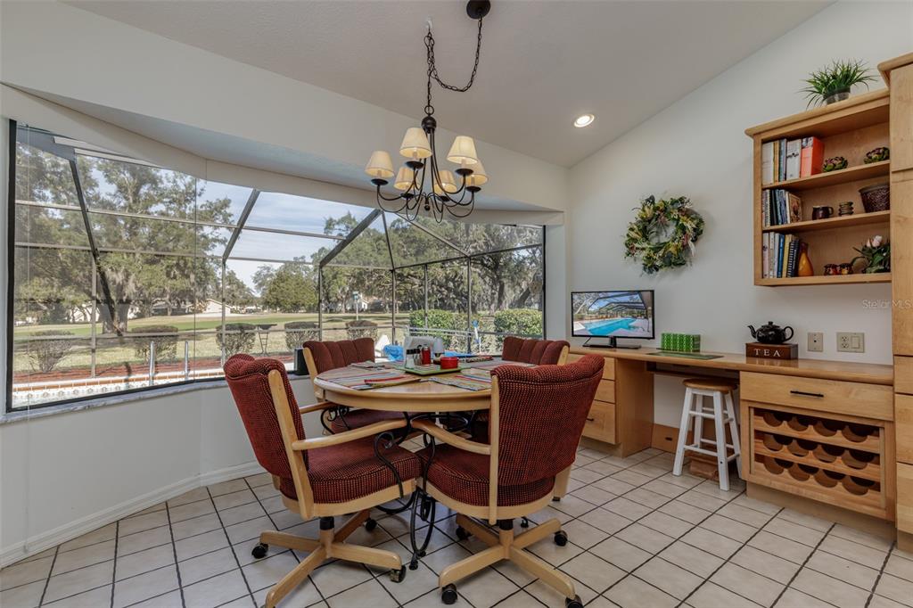 115 East Ireland Court Hernando, FL 34442 - Photo 31 of 55 a dining room with furniture a chandelier and window