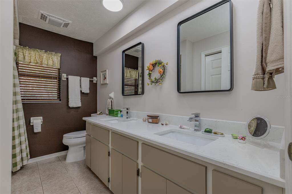 115 East Ireland Court Hernando, FL 34442 - Photo 37 of 55 a bathroom with a toilet sink and mirror