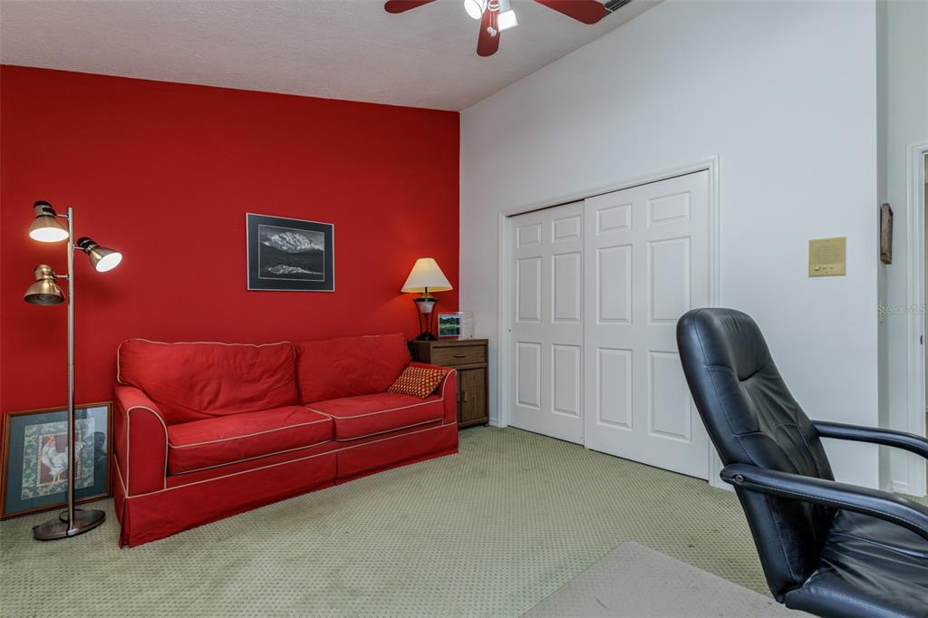 115 East Ireland Court Hernando, FL 34442 - Photo 39 of 55 a living room with furniture and a chandelier