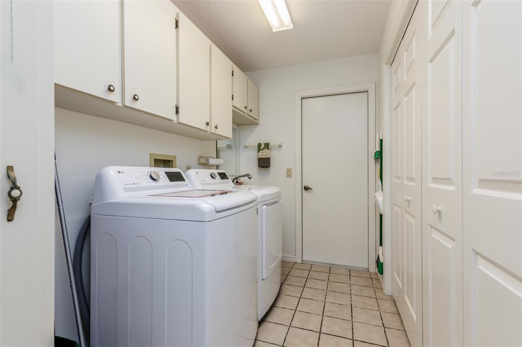 115 East Ireland Court Hernando, FL 34442 - Photo 40 of 55 a utility room with cabinets washer and dryer