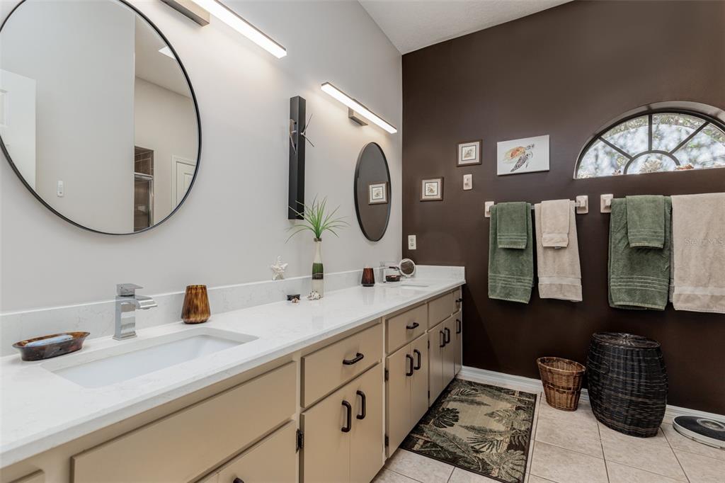 115 East Ireland Court Hernando, FL 34442 - Photo 44 of 55 a bathroom with a double vanity sink and a mirror