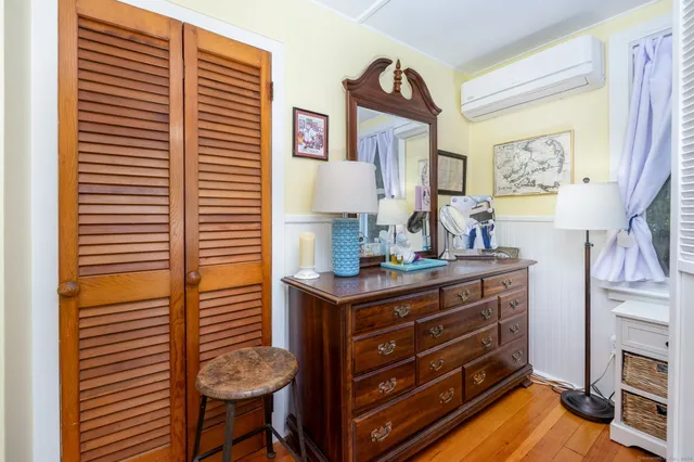a view of a door with a bench and a window
