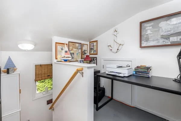 a bed room with a bed and a book shelf