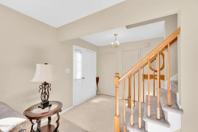 a view of an entryway with wooden floor