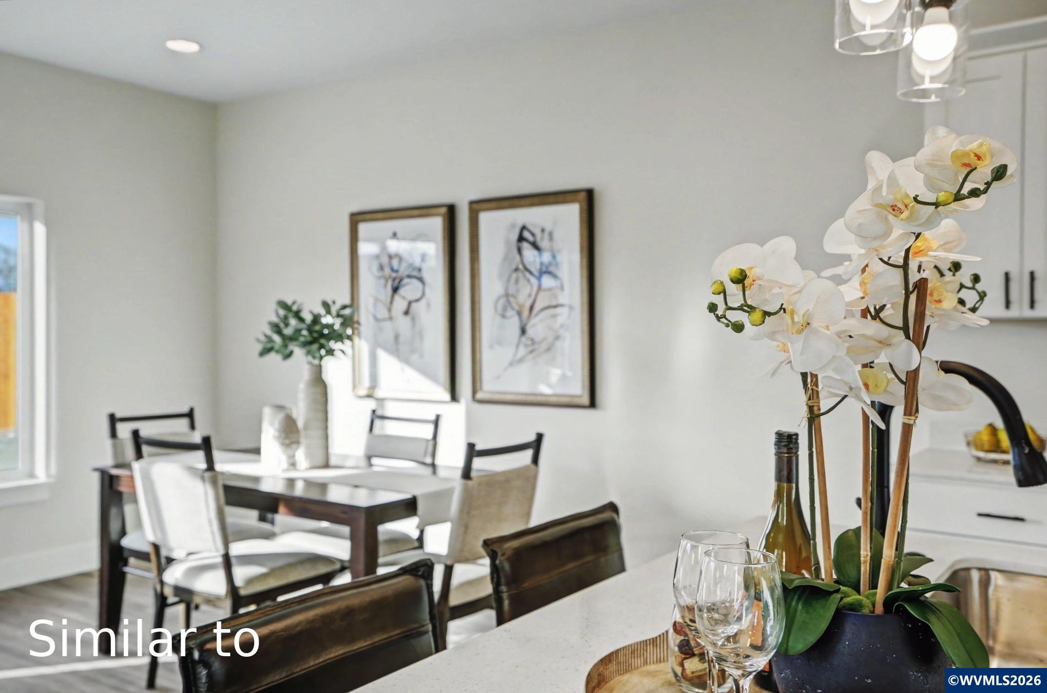 2550 Promise Way Lebanon, OR 97355 - Photo 11 of 35 a dining room with furniture potted plants and wooden floor