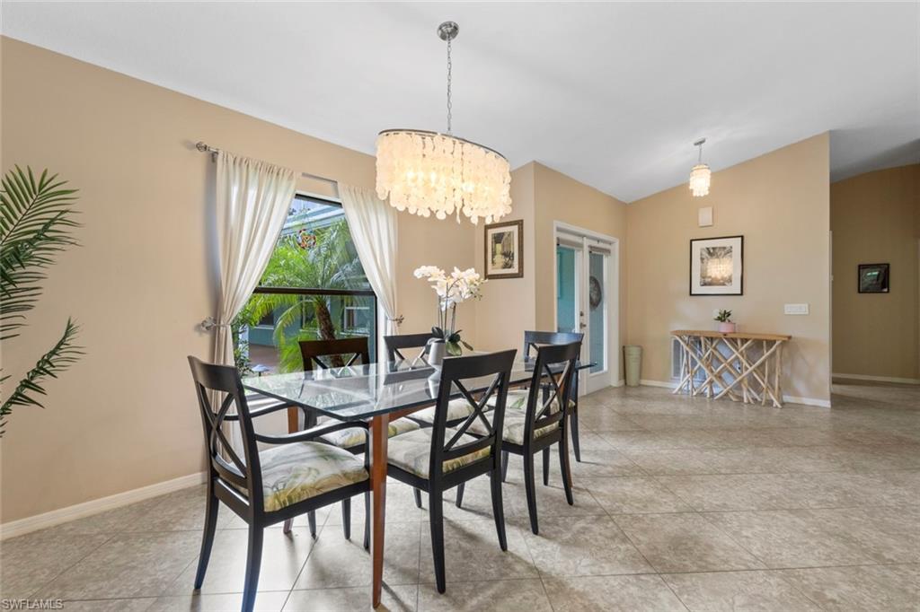6060 Painted Leaf Lane Naples, FL 34116 - Photo 15 of 49 a view of a dining room with furniture and a chandelier
