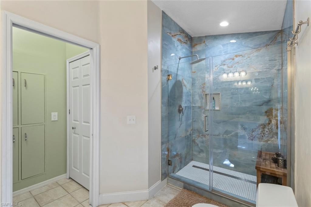 6060 Painted Leaf Lane Naples, FL 34116 - Photo 18 of 49 a bathroom with a shower and a sink