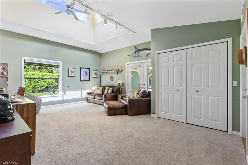 6060 Painted Leaf Lane Naples, FL 34116 - Photo 23 of 49 a living room with furniture and a window