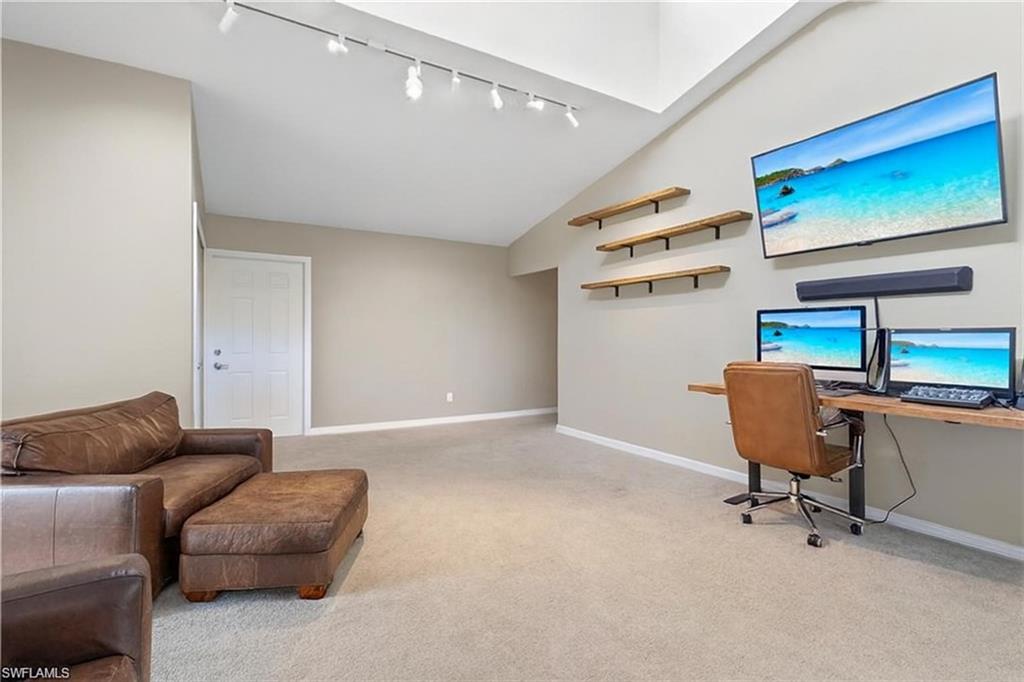 6060 Painted Leaf Lane Naples, FL 34116 - Photo 26 of 49 a livingroom with workspace