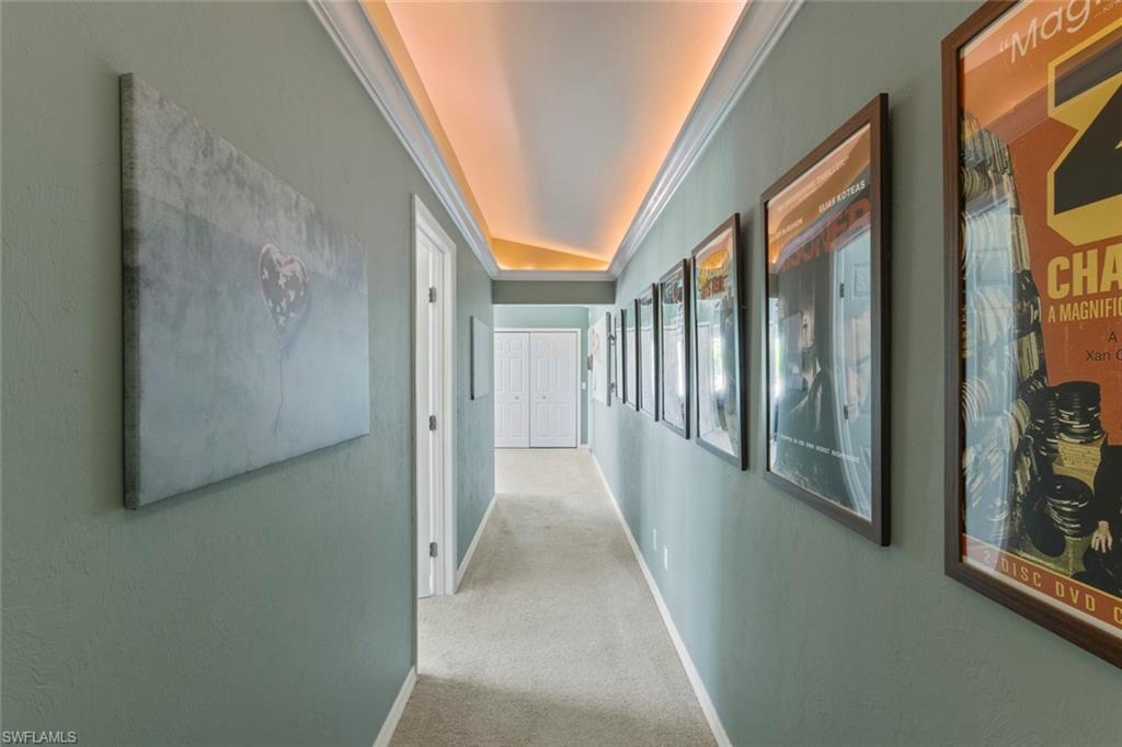 6060 Painted Leaf Lane Naples, FL 34116 - Photo 28 of 49 a view of a hallway with windows