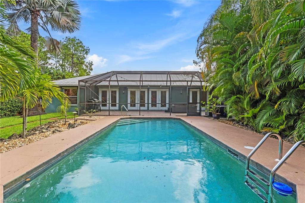 6060 Painted Leaf Lane Naples, FL 34116 - Photo 3 of 49 a view of a house with swimming pool