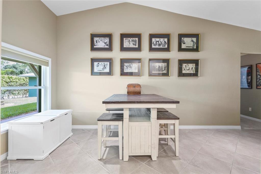 6060 Painted Leaf Lane Naples, FL 34116 - Photo 35 of 49 a workspace with a table and a chair