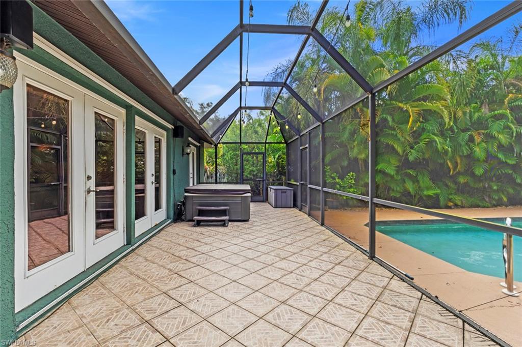 6060 Painted Leaf Lane Naples, FL 34116 - Photo 40 of 49 a view of a chairs and table in the balcony