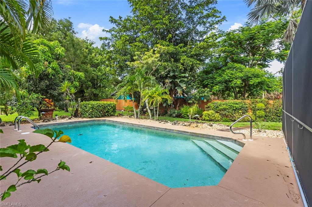 6060 Painted Leaf Lane Naples, FL 34116 - Photo 41 of 49 a view of a swimming pool with a patio