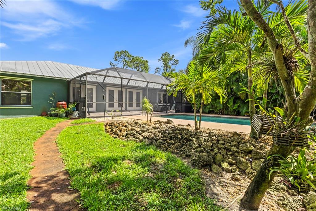 6060 Painted Leaf Lane Naples, FL 34116 - Photo 44 of 49 a view of a house with a yard
