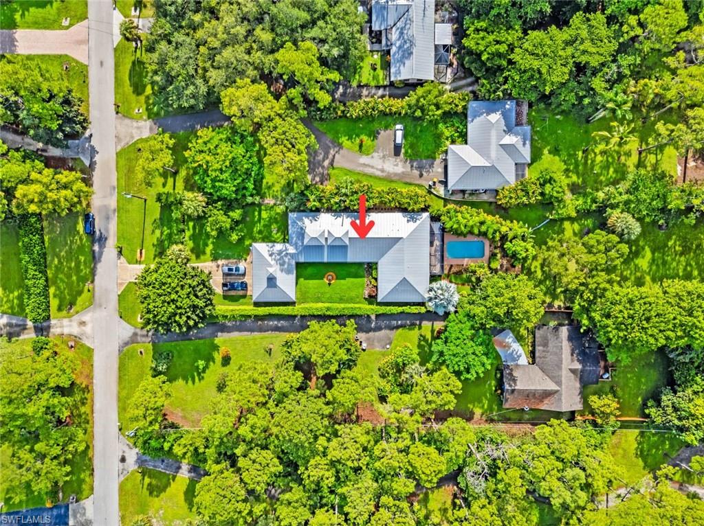 6060 Painted Leaf Lane Naples, FL 34116 - Photo 47 of 49 an aerial view of a house with a yard and fountain