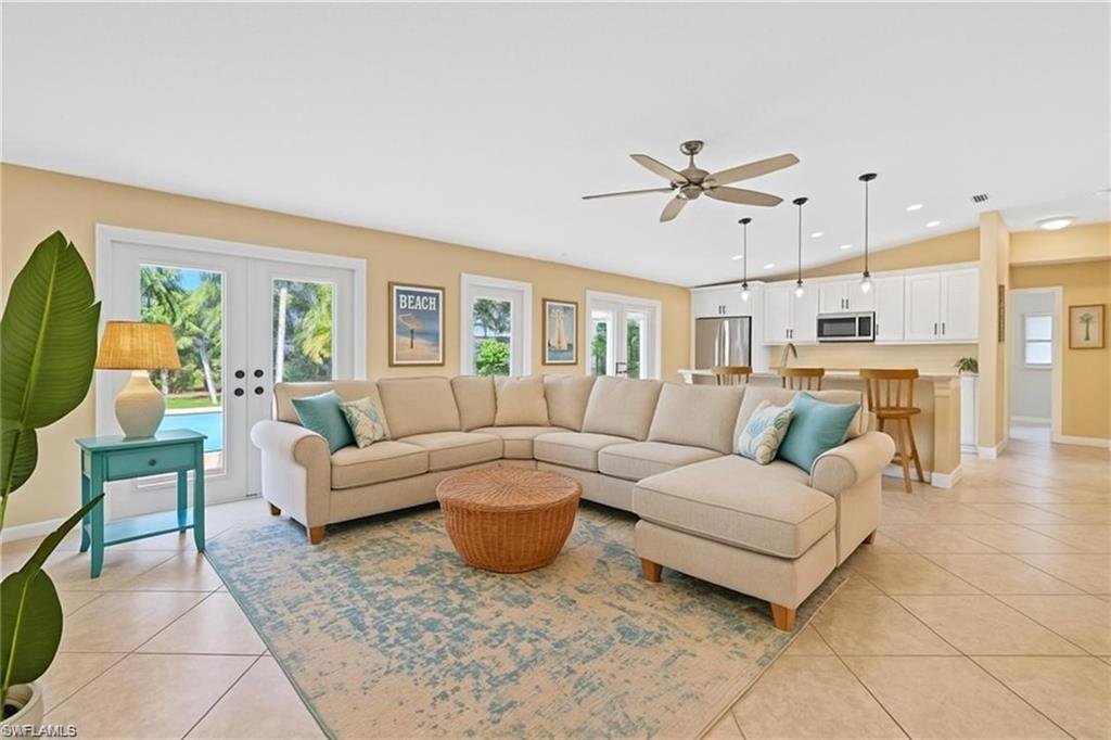 6060 Painted Leaf Lane Naples, FL 34116 - Photo 8 of 49 a living room with furniture and a large window