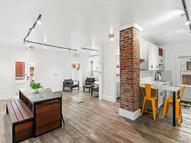 a bathroom with a sink mirror and toilet