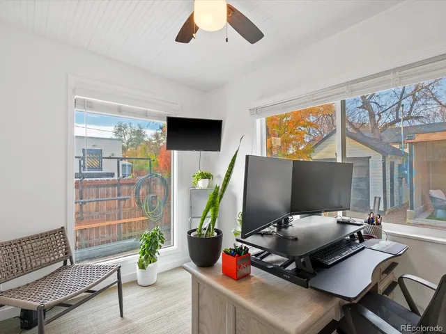 a workspace with furniture and natural light