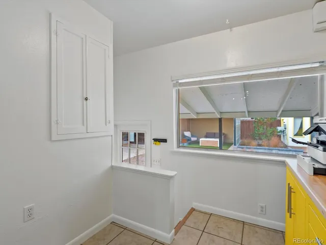 a view of storage and utility room with closet