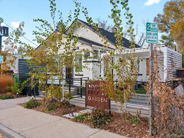 a view of entryway with wooden floor and livingroom view