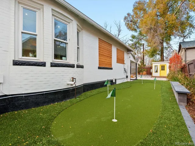 a view of swimming pool with a backyard