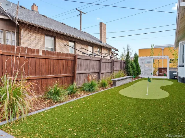 a view of a swimming pool with a backyard