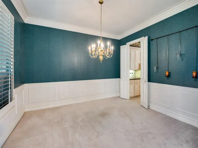 a kitchen with stainless steel appliances granite countertop a sink and a stove