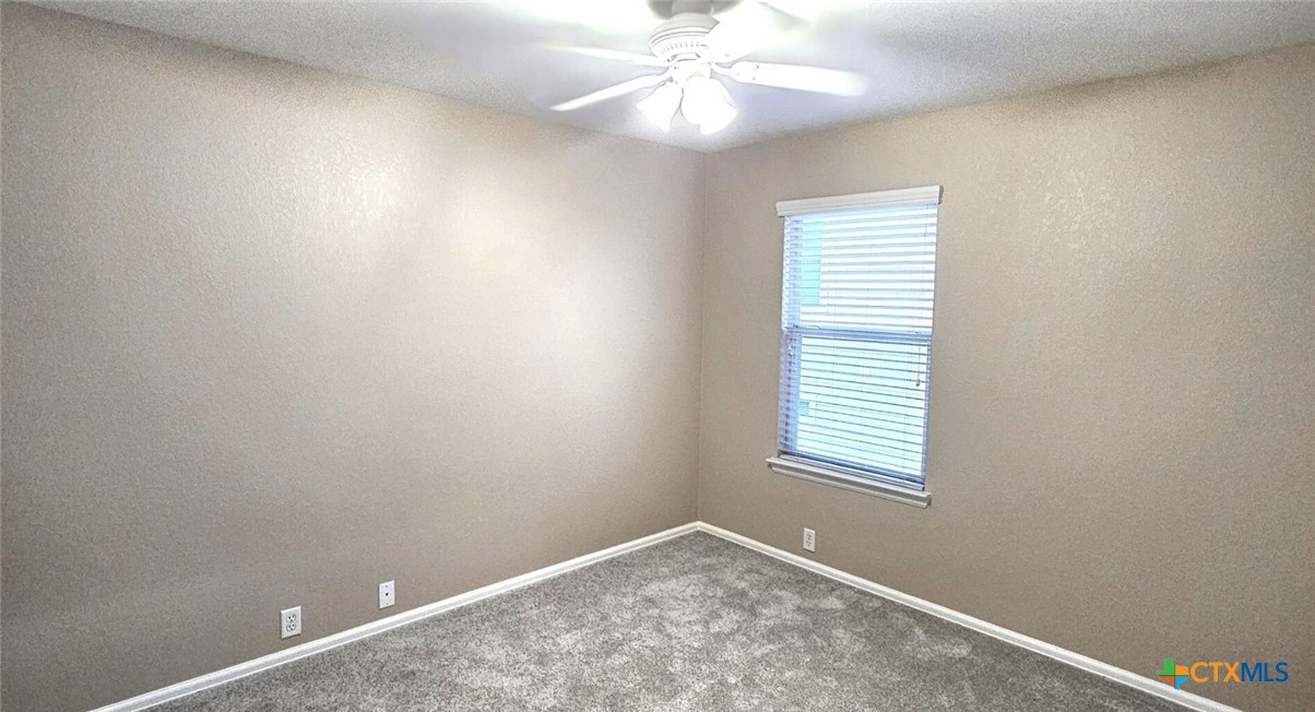 6046 Mule Deer Schertz, TX 78108 - Photo 12 of 19 an empty room with windows and fan