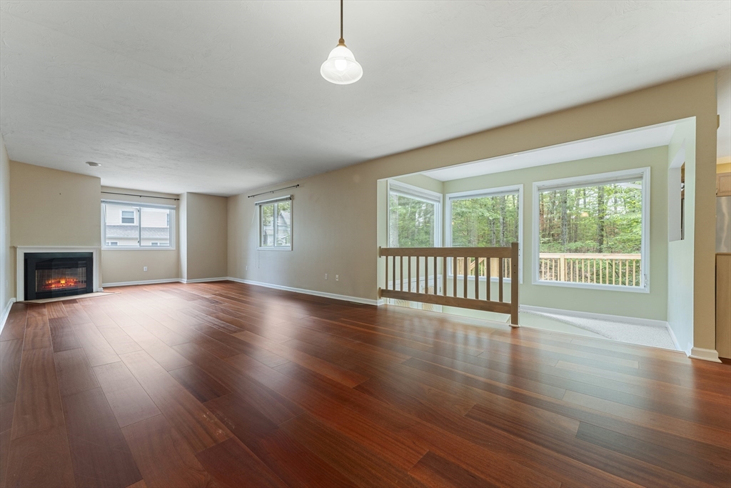 22 Arrowhead Circle, Unit 22 Ashland, MA 01721 - Photo 5 of 35 a view of an empty room with wooden floor and a window