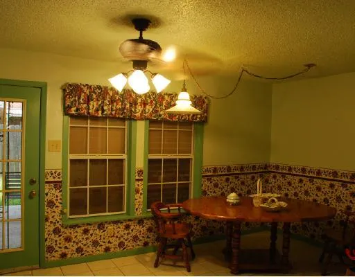 a view of a chairs and table in a patio