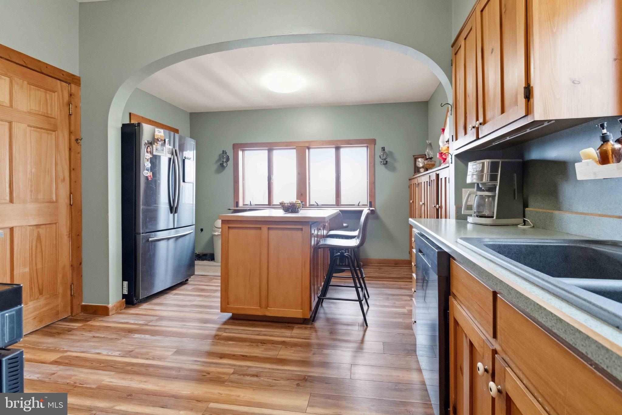 38 State Road Barnesville, PA 18214 - Photo 13 of 46 a kitchen with stainless steel appliances granite countertop a refrigerator a sink a stove and cabinets