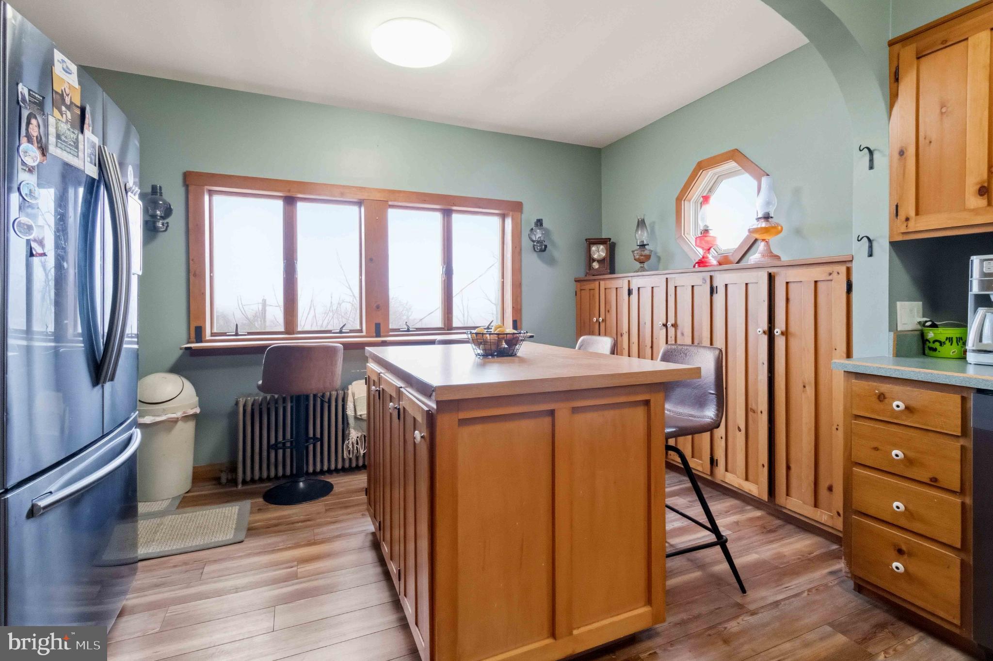38 State Road Barnesville, PA 18214 - Photo 15 of 46 a view of kitchen with stainless steel appliances granite countertop a stove a sink dishwasher and a dining table with wooden floor