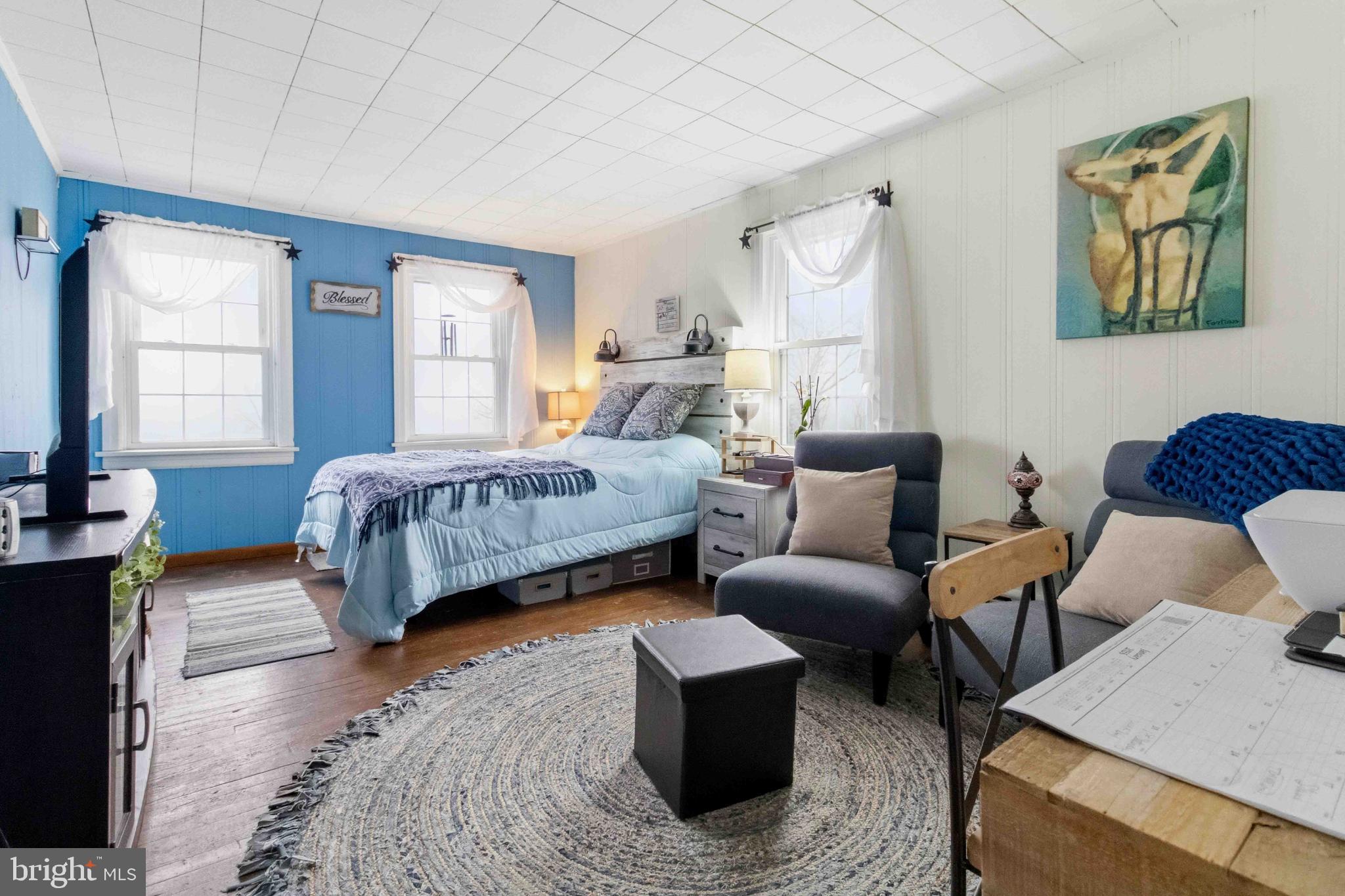 38 State Road Barnesville, PA 18214 - Photo 28 of 46 a bedroom with a bed and wooden floor