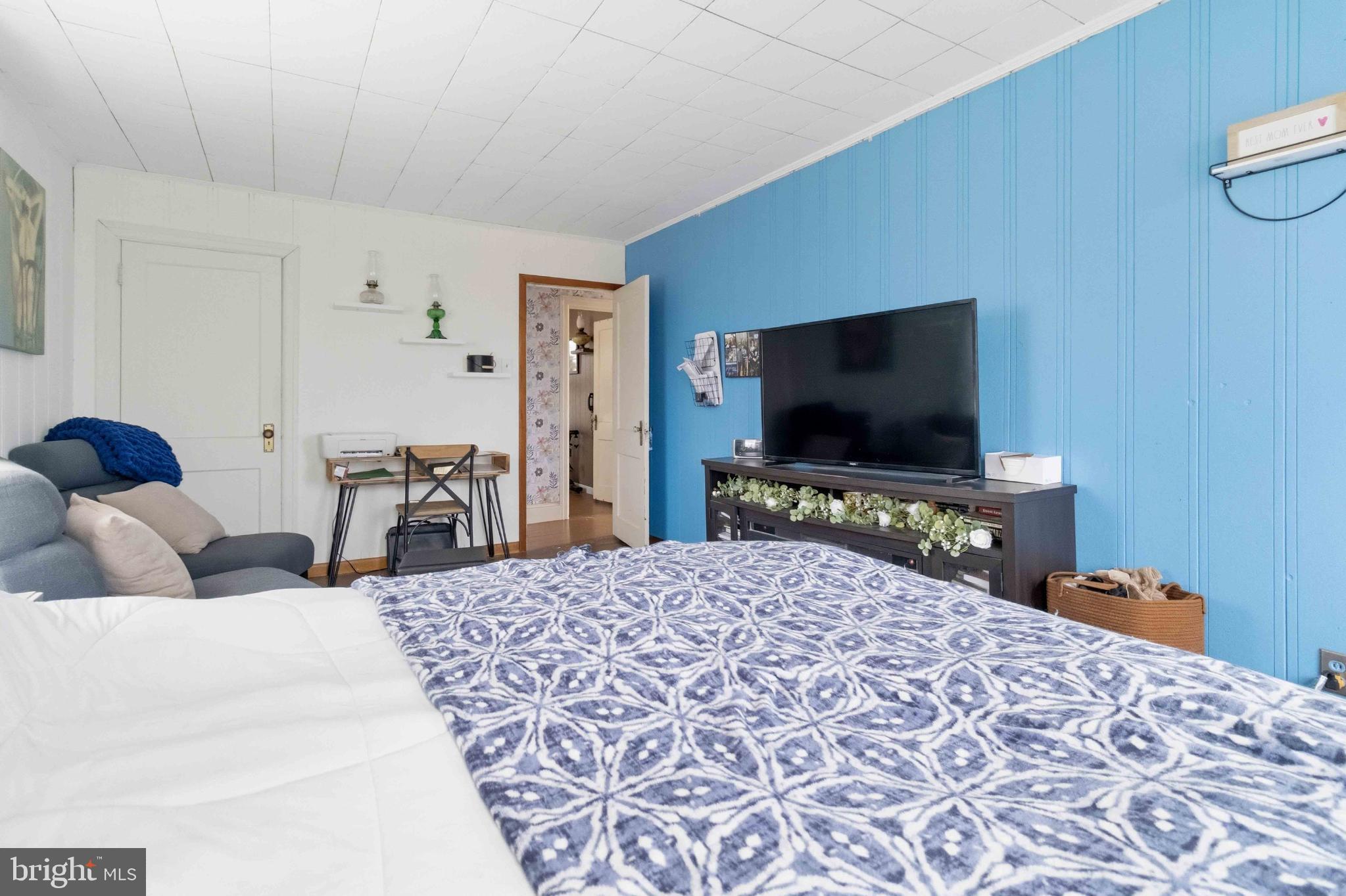 38 State Road Barnesville, PA 18214 - Photo 29 of 46 a bedroom with a bed and a flat screen tv