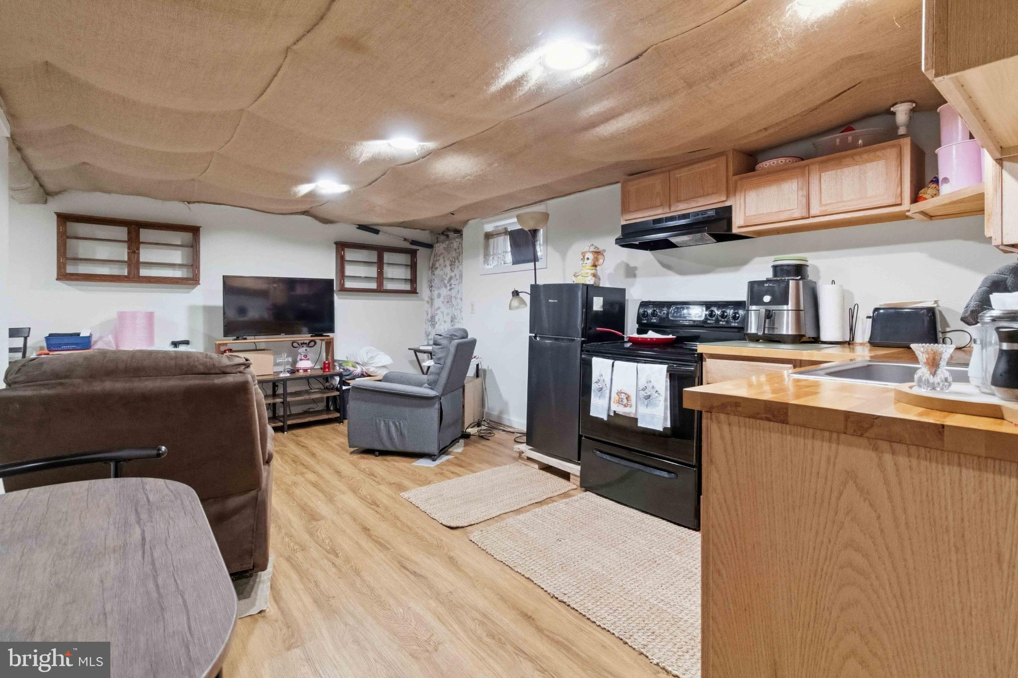 38 State Road Barnesville, PA 18214 - Photo 32 of 46 a kitchen with stainless steel appliances granite countertop a stove top oven a sink dishwasher and a refrigerator with the cabinets