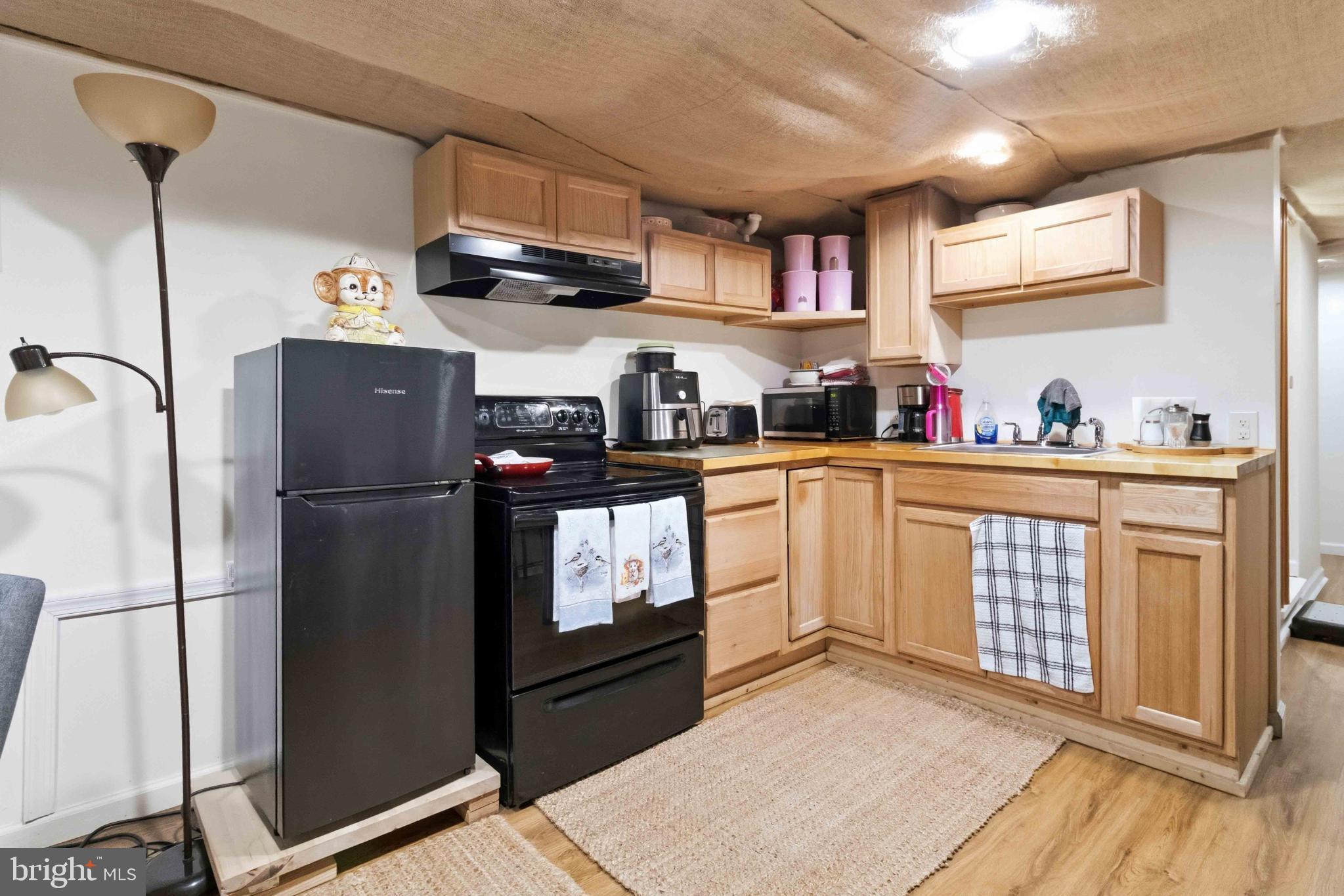 38 State Road Barnesville, PA 18214 - Photo 33 of 46 a kitchen with stainless steel appliances a refrigerator sink and cabinets