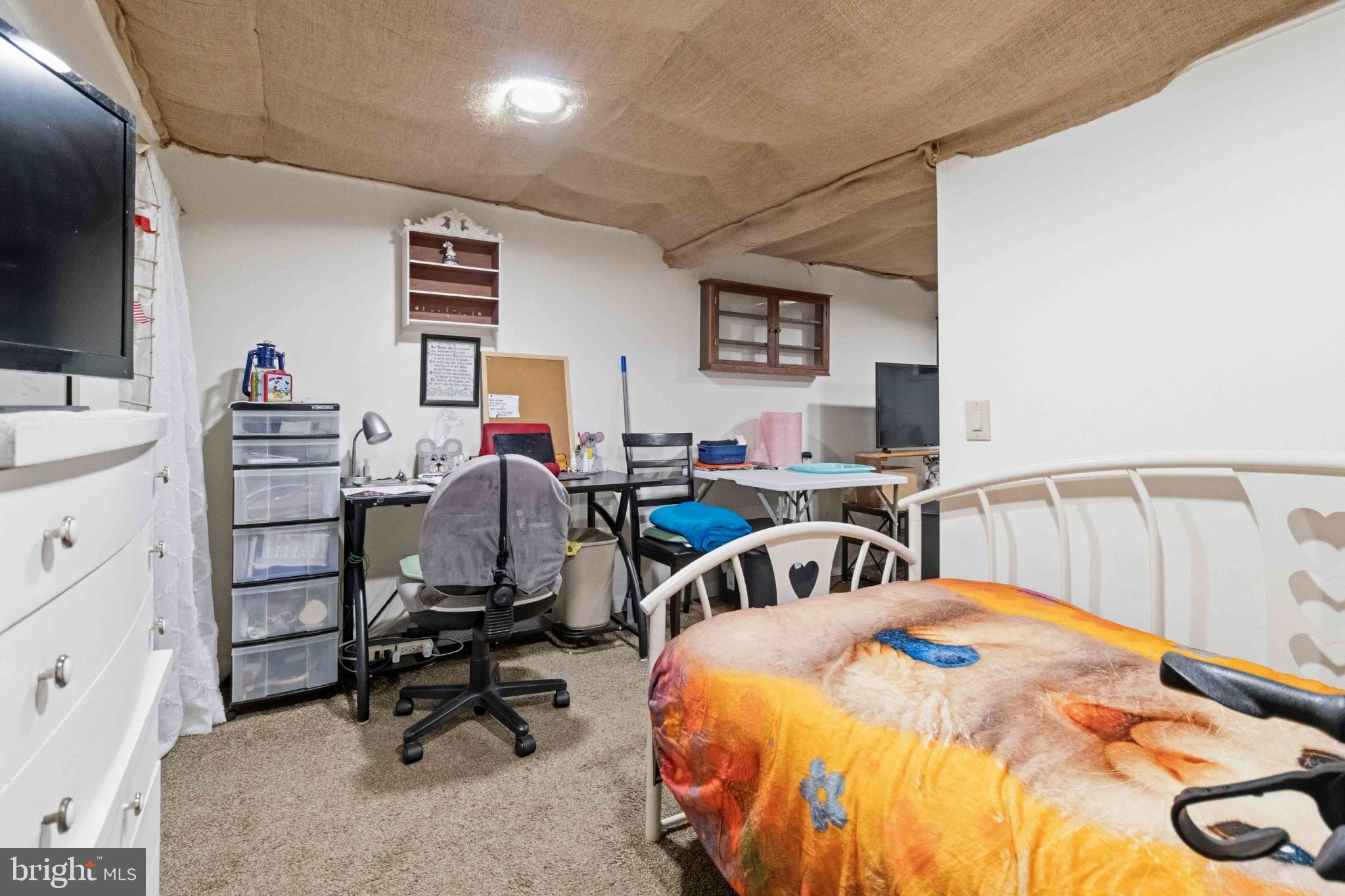 38 State Road Barnesville, PA 18214 - Photo 36 of 46 a bedroom with bed and a flat tv screen on the dresser