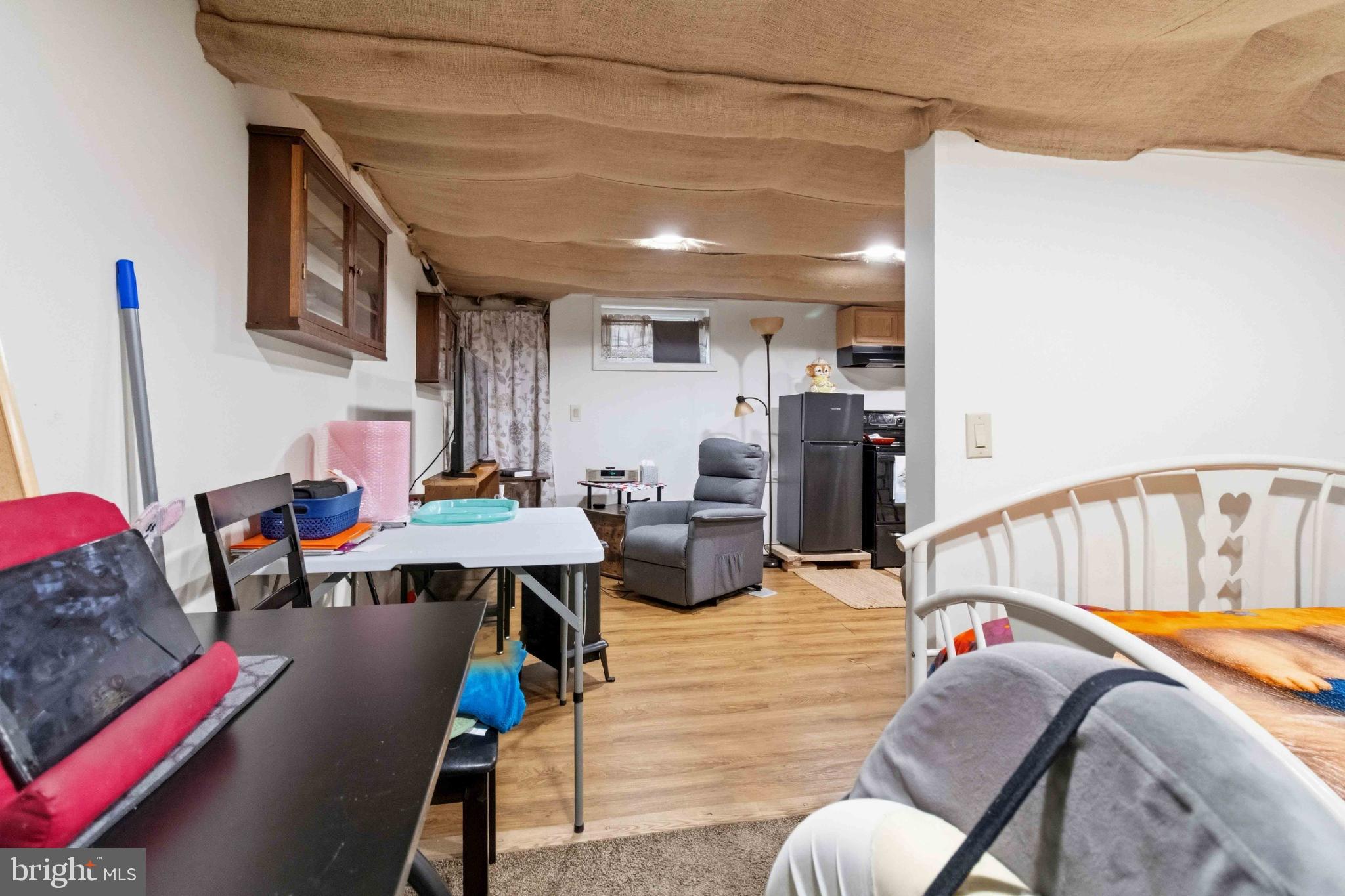 38 State Road Barnesville, PA 18214 - Photo 37 of 46 a living room with furniture and a dining table with wooden floor
