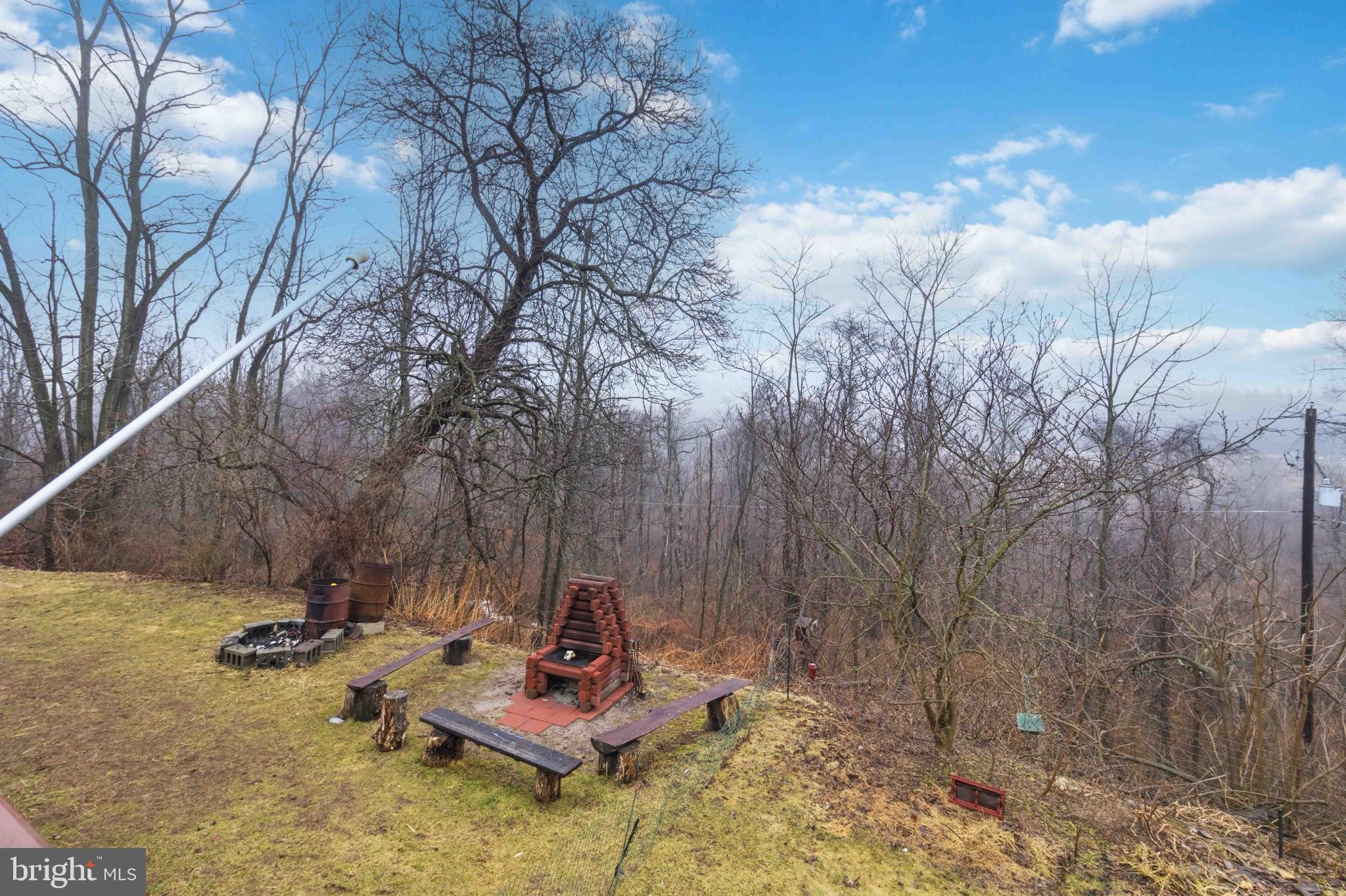 38 State Road Barnesville, PA 18214 - Photo 39 of 46 a backyard of a house with table and chairs
