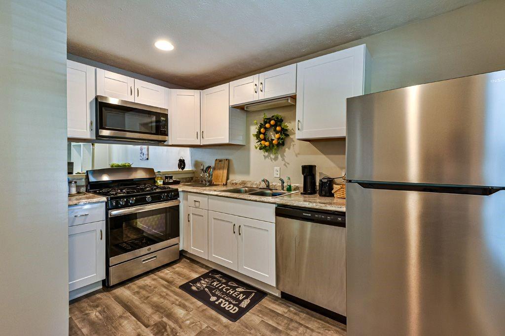 1925 Shenandoah Valley Lane Southeast Smyrna, GA 30080 - Photo 1 of 1 a kitchen with stainless steel appliances a refrigerator stove and microwave