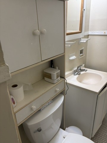 2513 Hazard Street Houston, TX 77019 - Photo 18 of 18 a bathroom with a sink toilet and vanity