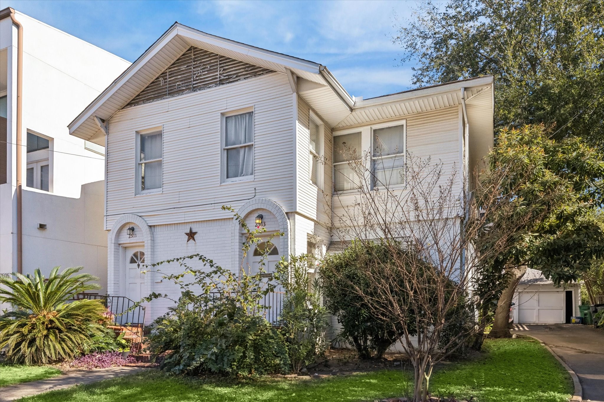 2513 Hazard Street Houston, TX 77019 - Photo 2 of 18 a front view of a house with garden
