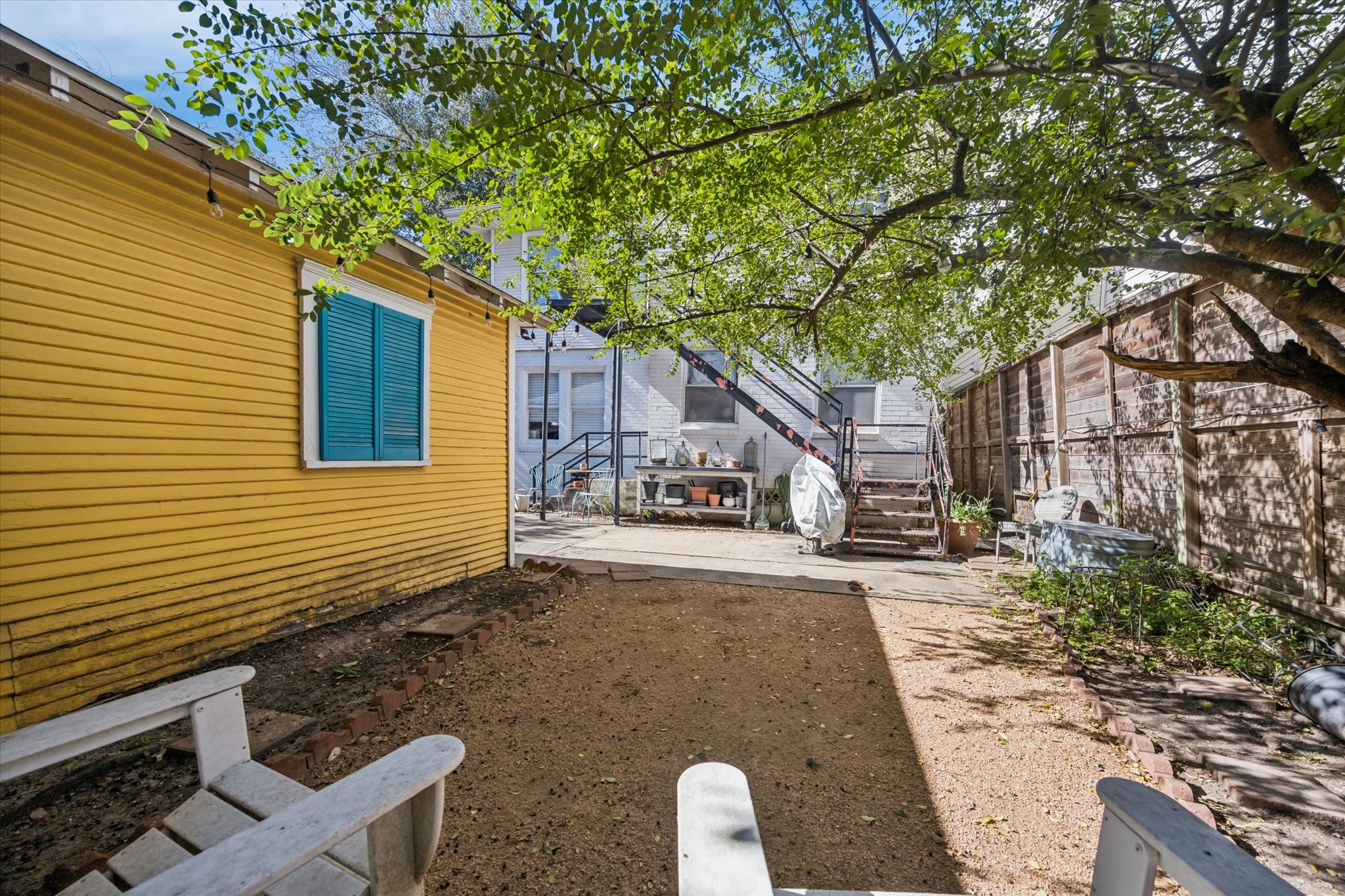 2513 Hazard Street Houston, TX 77019 - Photo 5 of 18 a front view of a house with a yard and trees