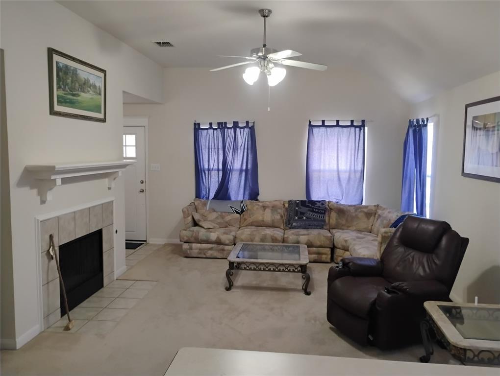 11705 Netleaf Lane Fort Worth, TX 76244 - Photo 11 of 20 a living room with furniture and a fireplace