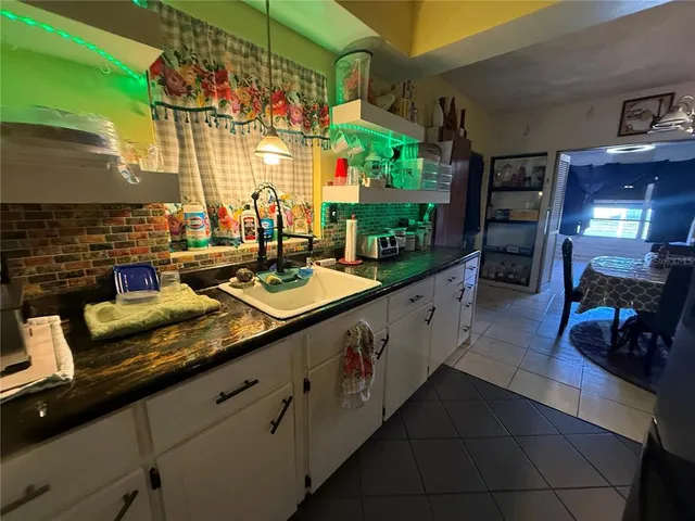 a view of living room with furniture and a flat screen tv