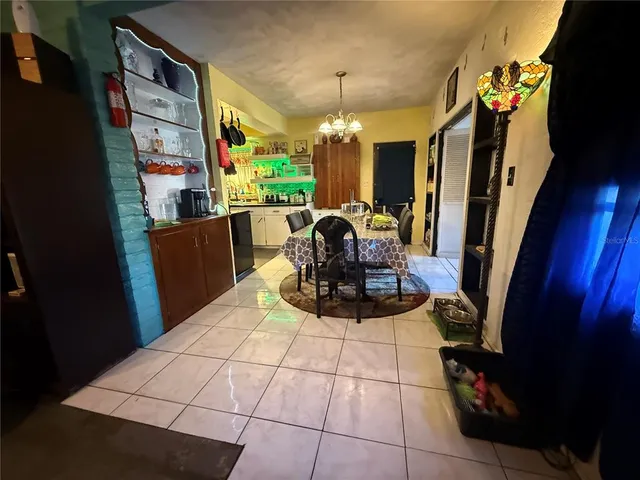 a bed room with a bed and a mirror