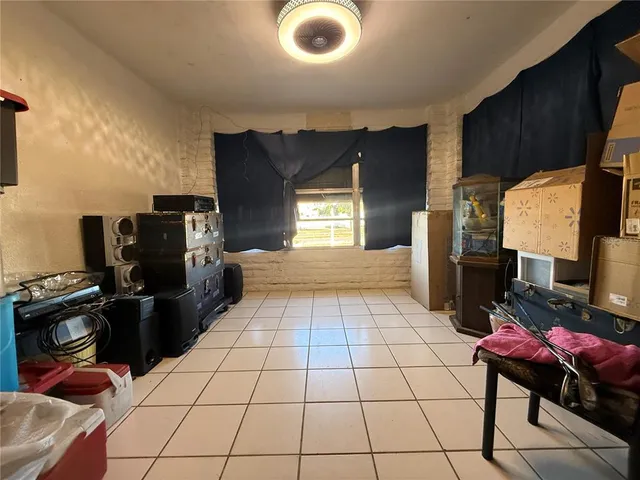 a view of a dining room with furniture and a window